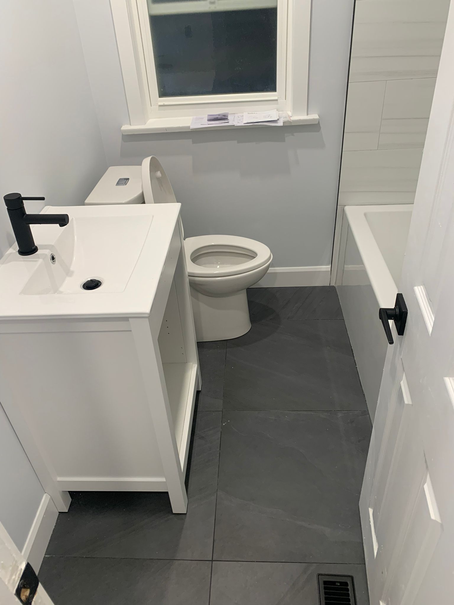 Vanity and slate floor