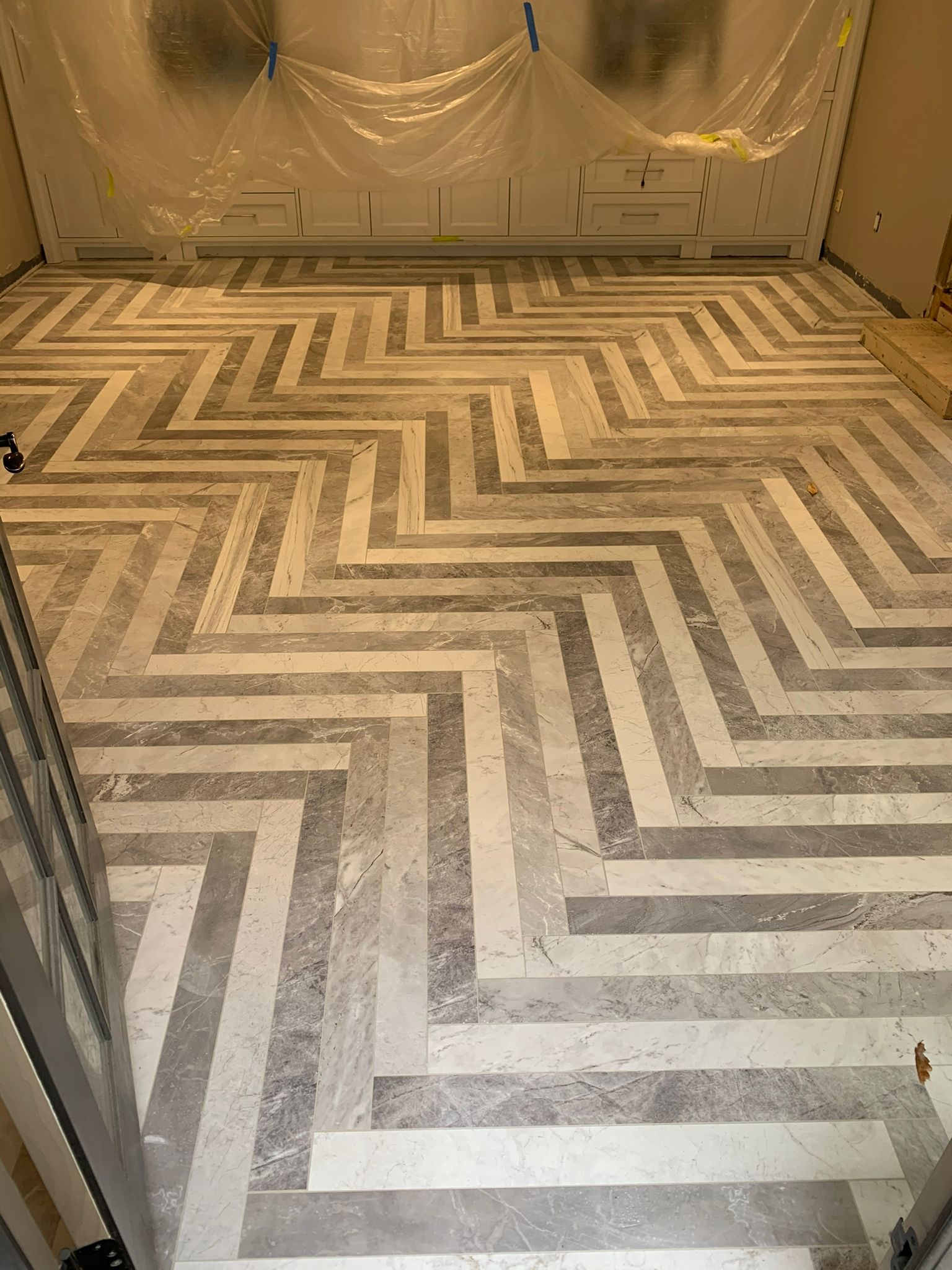 Marble herringbone floor in dining area