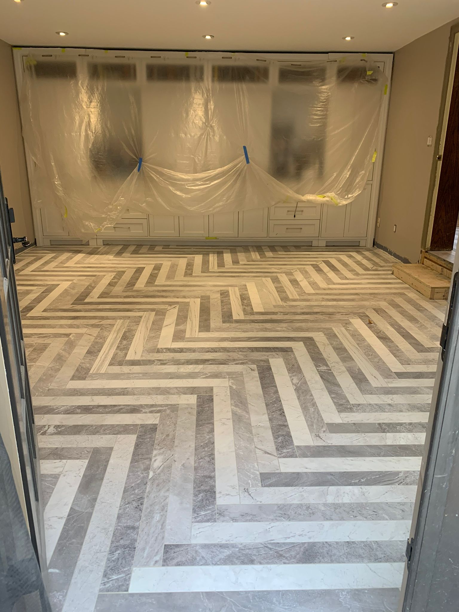 Herringbone tile installation